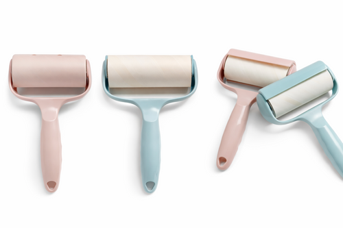 Four colorful lint rollers on a white background